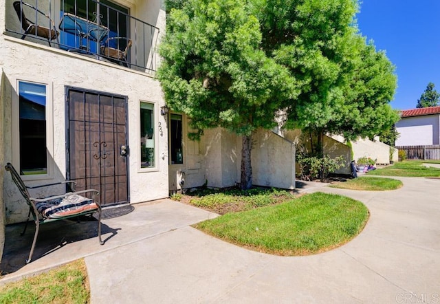 264 Espanas Gln, Escondido, CA 92026 - doorway to property featuring stucco siding and a patio