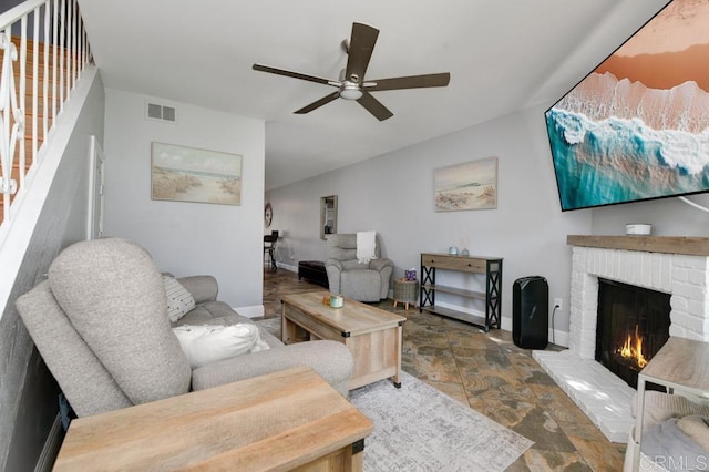 264 Espanas Gln, Escondido, CA 92026 - living area with stone tile floors, a brick fireplace, ceiling fan, stairway, and baseboards