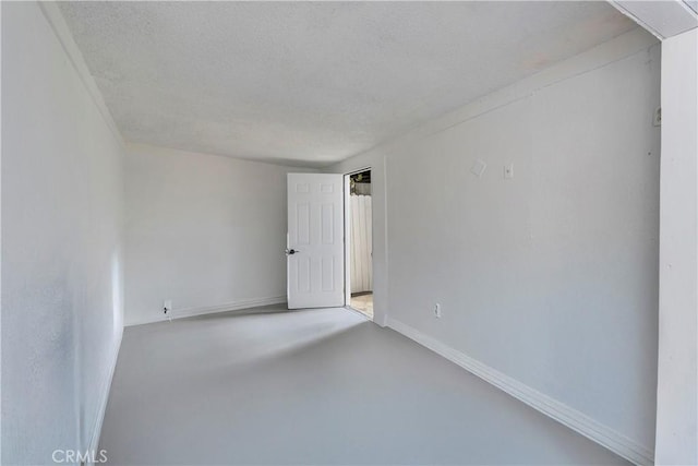 3140 Pluma St, Lynwood, CA 90262 - unfurnished room featuring a textured ceiling and concrete flooring