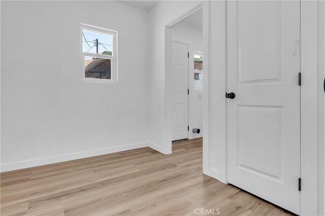 3140 Pluma St, Lynwood, CA 90262 - hallway featuring baseboards and light wood finished floors