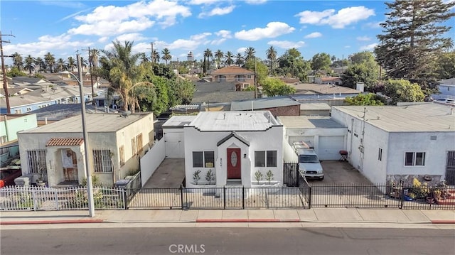 3140 Pluma St, Lynwood, CA 90262 - view of front facade with a fenced front yard, stucco siding, and a residential view