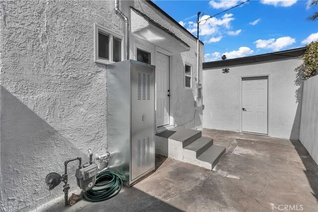 3140 Pluma St, Lynwood, CA 90262 - doorway to property featuring stucco siding