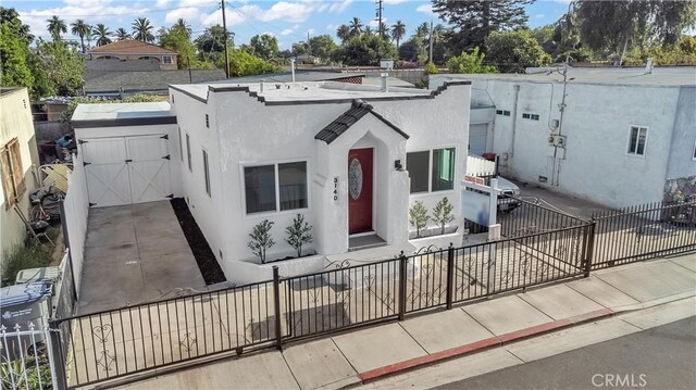 3140 Pluma St, Lynwood, CA 90262 - mediterranean / spanish house with a fenced front yard and stucco siding