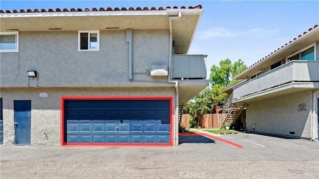 2413 N Deodar St Unit 3, Santa Ana, CA 92705 - view of side of property with stucco siding and stairway