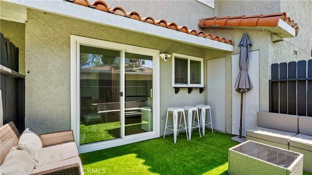 2413 N Deodar St Unit 3, Santa Ana, CA 92705 - exterior space featuring stucco siding, an outdoor living space, and a yard