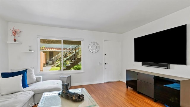 2413 N Deodar St Unit 3, Santa Ana, CA 92705 - living area featuring light wood finished floors and baseboards