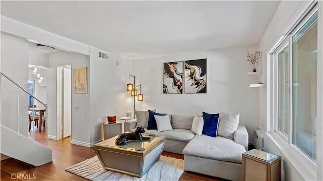 2413 N Deodar St Unit 3, Santa Ana, CA 92705 - living room with wood finished floors, healthy amount of natural light, and baseboards