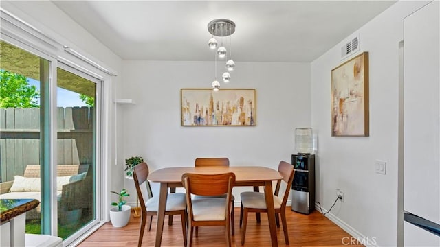 2413 N Deodar St Unit 3, Santa Ana, CA 92705 - dining area with wood finished floors and baseboards