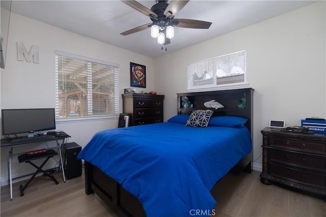 5611 Harold St, Riverside, CA 92503 - bedroom with wood finished floors, ceiling fan, and baseboards