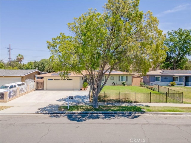 5611 Harold St, Riverside, CA 92503 - view of front of house featuring driveway, stucco siding, a garage, and solar panels