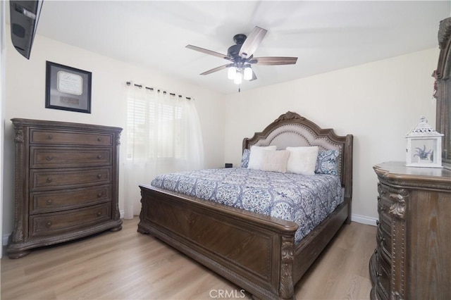 5611 Harold St, Riverside, CA 92503 - bedroom with light wood-style flooring and ceiling fan
