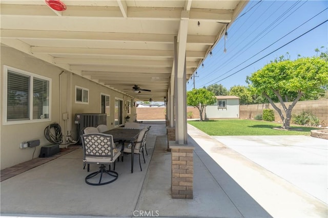 5611 Harold St, Riverside, CA 92503 - view of patio / terrace featuring ceiling fan, outdoor dining space, an outbuilding, and central AC