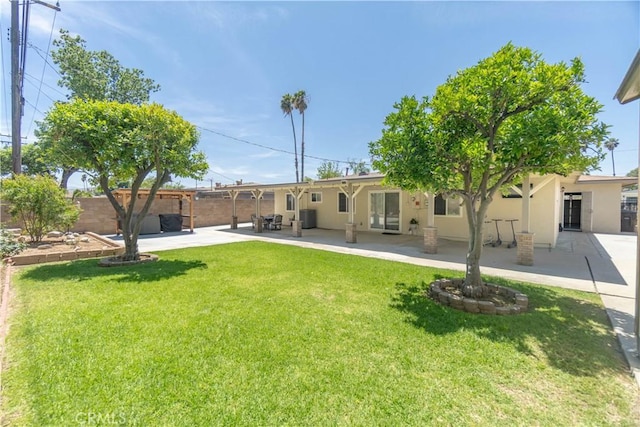 5611 Harold St, Riverside, CA 92503 - back of property featuring a patio area and stucco siding