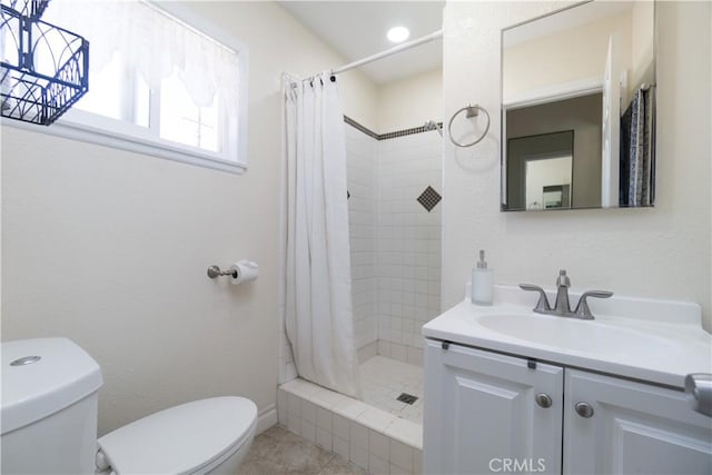 5611 Harold St, Riverside, CA 92503 - bathroom featuring toilet, vanity, a shower stall, and tile patterned floors