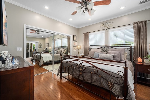 4538 Conquista Ave, Lakewood, CA 90713 - bedroom with wood-type flooring, recessed lighting, crown molding, ceiling fan, and a closet