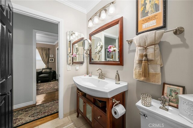 4538 Conquista Ave, Lakewood, CA 90713 - half bath featuring crown molding, vanity, toilet, and baseboards