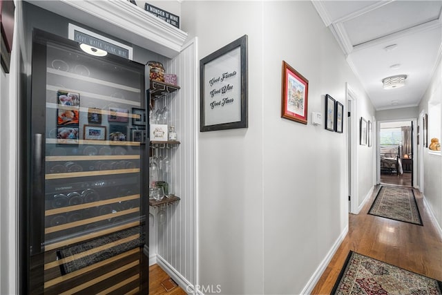 4538 Conquista Ave, Lakewood, CA 90713 - hallway featuring beverage cooler, wood finished floors, baseboards, ornamental molding, and attic access