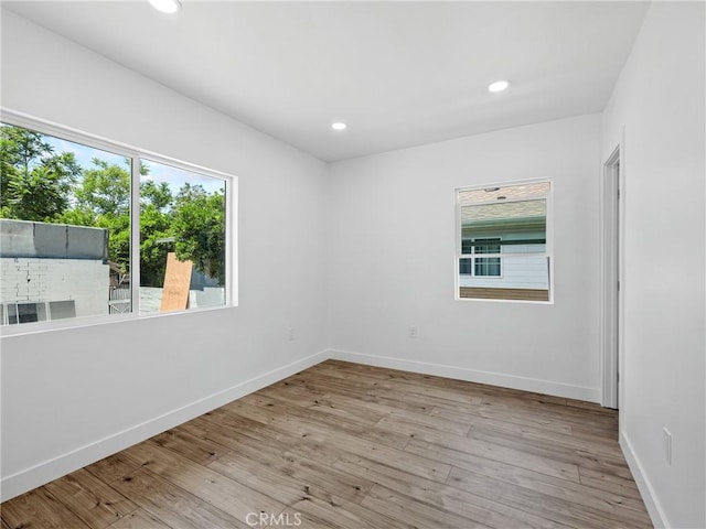 257 W 11th St, San Bernardino, CA 92410 - empty room featuring wood finished floors, baseboards, and recessed lighting