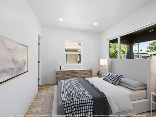 257 W 11th St, San Bernardino, CA 92410 - bedroom with light wood-type flooring, recessed lighting, and baseboards