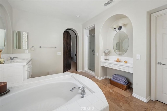 26800 Fairlain Dr, Valencia, CA 91355 - bathroom with a bath, a shower stall, vanity, and baseboards