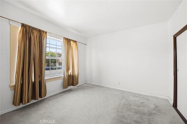 1222 N Virgil Ave, Los Angeles, CA 90029 - carpeted empty room with baseboards