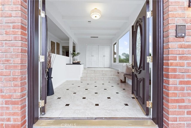 1929 Dorothea Rd, La Habra Heights, CA 90631 - entrance foyer featuring brick wall, light tile patterned flooring, and baseboards