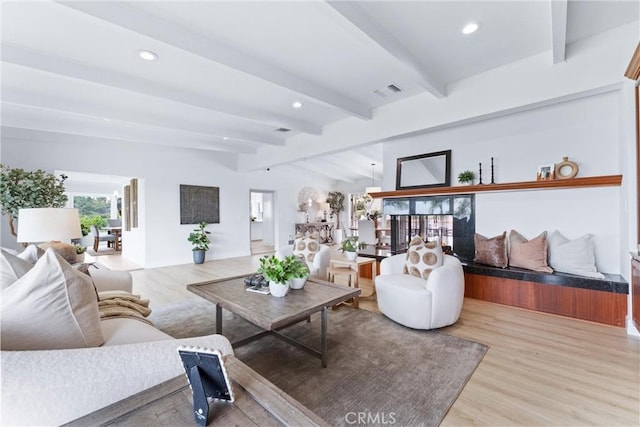 1929 Dorothea Rd, La Habra Heights, CA 90631 - living area featuring wood finished floors, beam ceiling, and recessed lighting