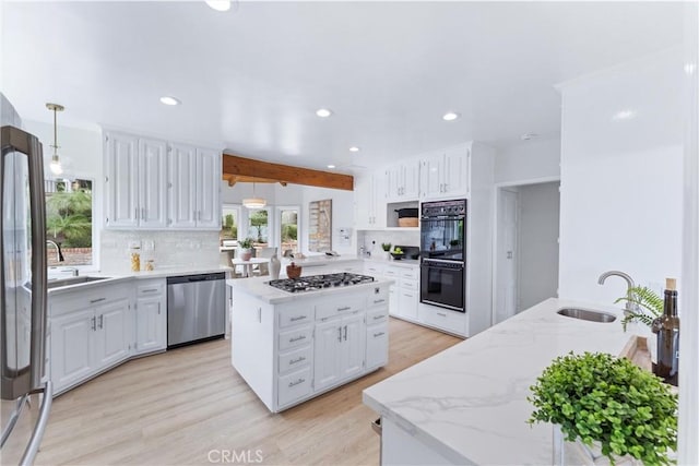 1929 Dorothea Rd, La Habra Heights, CA 90631 - kitchen with stainless steel appliances, a sink, recessed lighting, decorative backsplash, and white cabinets