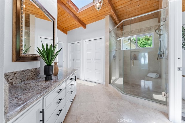 1929 Dorothea Rd, La Habra Heights, CA 90631 - bathroom with wood ceiling, vanity, a skylight, a stall shower, and tile patterned floors