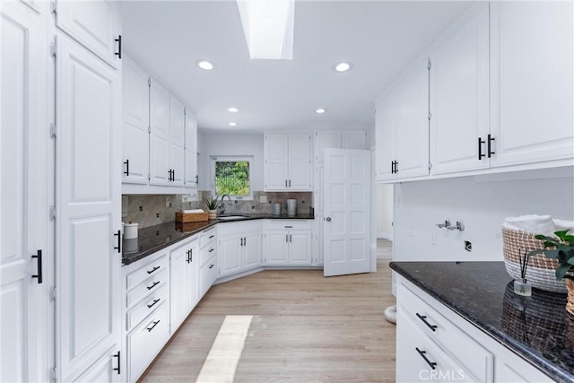 1929 Dorothea Rd, La Habra Heights, CA 90631 - kitchen with a sink, white cabinets, recessed lighting, tasteful backsplash, and light wood-type flooring