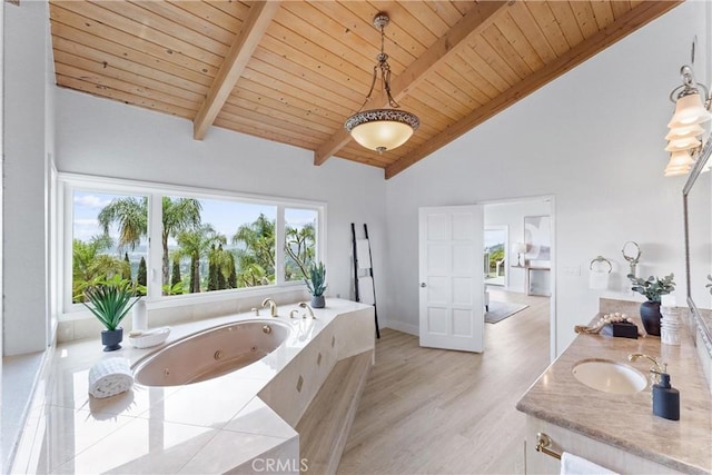 1929 Dorothea Rd, La Habra Heights, CA 90631 - bathroom with healthy amount of natural light, wood ceiling with exposed beams, a whirlpool tub, vanity, and wood finished floors