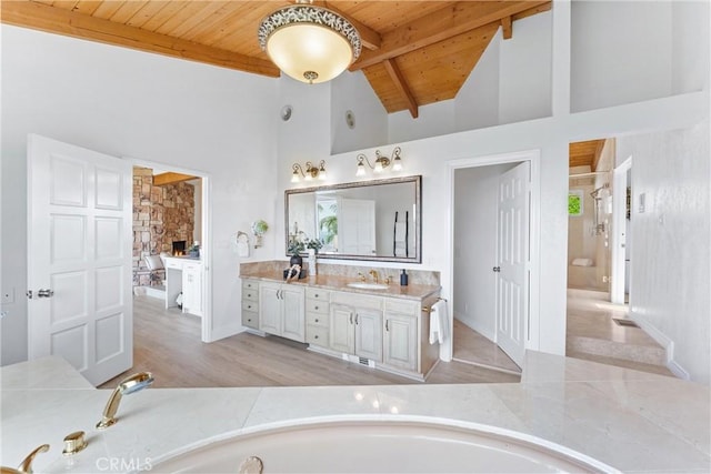 1929 Dorothea Rd, La Habra Heights, CA 90631 - bathroom featuring wooden ceiling with exposed beams, vanity, high vaulted ceiling, a bathtub, and wood finished floors