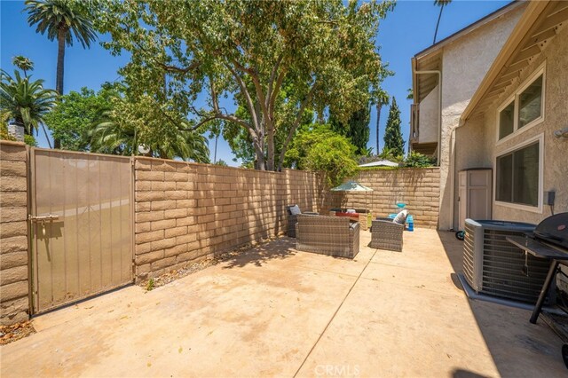 2627 Mangrove Way, Riverside, CA 92506 - fenced backyard featuring a patio area and central air condition unit