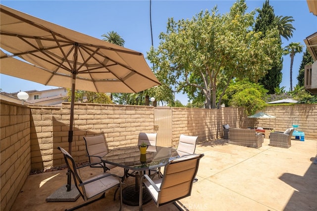 2627 Mangrove Way, Riverside, CA 92506 - fenced backyard with a patio and outdoor dining area