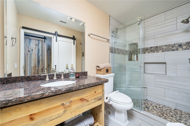 2627 Mangrove Way, Riverside, CA 92506 - full bath featuring vanity, a shower stall, toilet, and tile patterned floors
