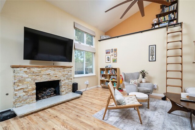 2627 Mangrove Way, Riverside, CA 92506 - living room with ceiling fan, wood finished floors, high vaulted ceiling, baseboards, and a fireplace