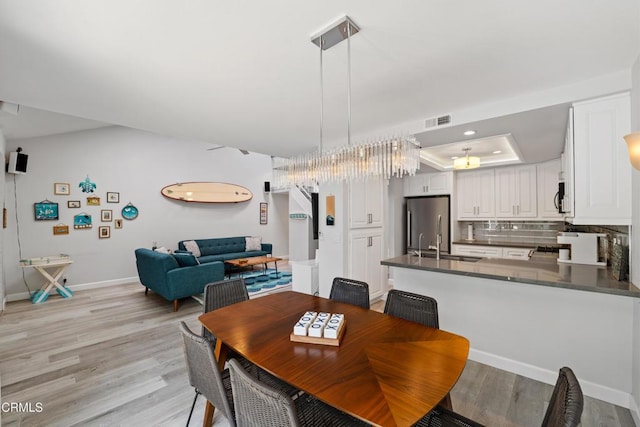 3125 Harbor Blvd, Oxnard, CA 93035 - dining room featuring light wood-style floors and baseboards
