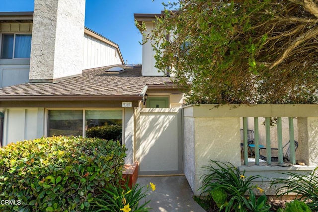3125 Harbor Blvd, Oxnard, CA 93035 - doorway to property featuring board and batten siding and a shingled roof