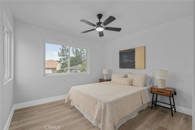 1468 Lemon Grove Dr, Upland, CA 91786 - bedroom with wood finished floors, baseboards, and a ceiling fan