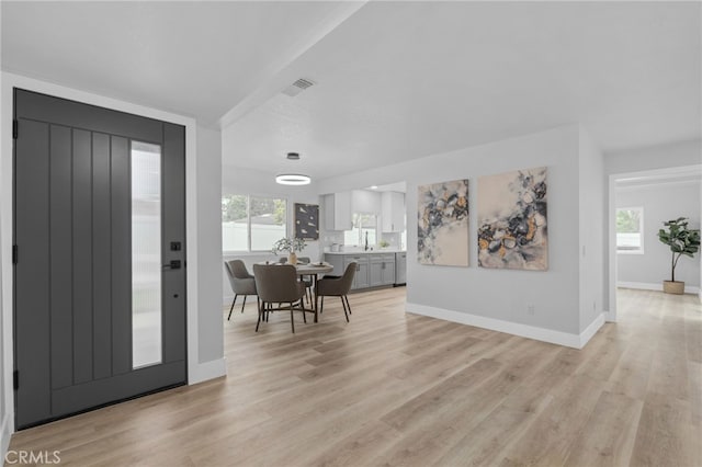 1468 Lemon Grove Dr, Upland, CA 91786 - foyer entrance featuring plenty of natural light, light wood-style flooring, and baseboards