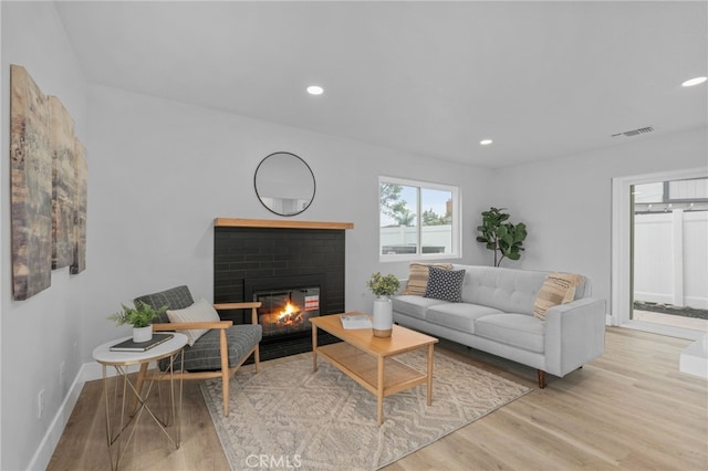 1468 Lemon Grove Dr, Upland, CA 91786 - living area featuring wood finished floors, a brick fireplace, recessed lighting, and baseboards