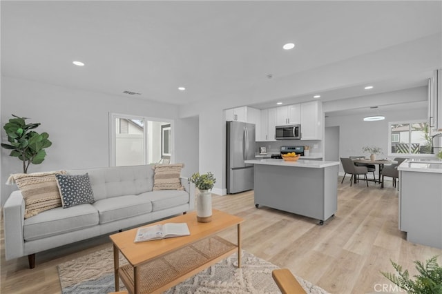1468 Lemon Grove Dr, Upland, CA 91786 - living room with light wood finished floors, recessed lighting, and baseboards