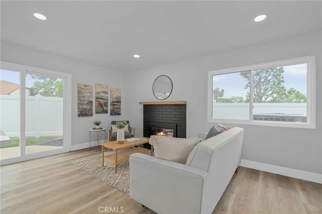 1468 Lemon Grove Dr, Upland, CA 91786 - living area with a brick fireplace, baseboards, light wood finished floors, and recessed lighting