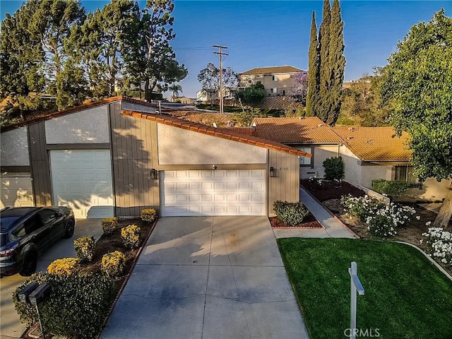 5760 Falling Leaf Ln, Jurupa Valley, CA 92509 - view of front of home with a tile roof and driveway