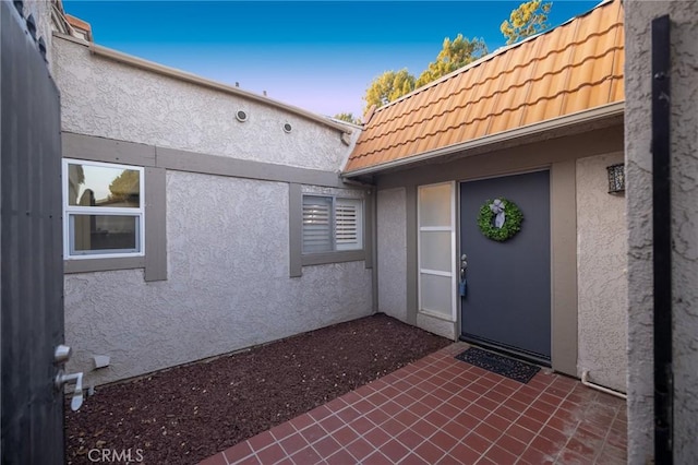 5760 Falling Leaf Ln, Jurupa Valley, CA 92509 - entrance to property with stucco siding, a tiled roof, and a patio area