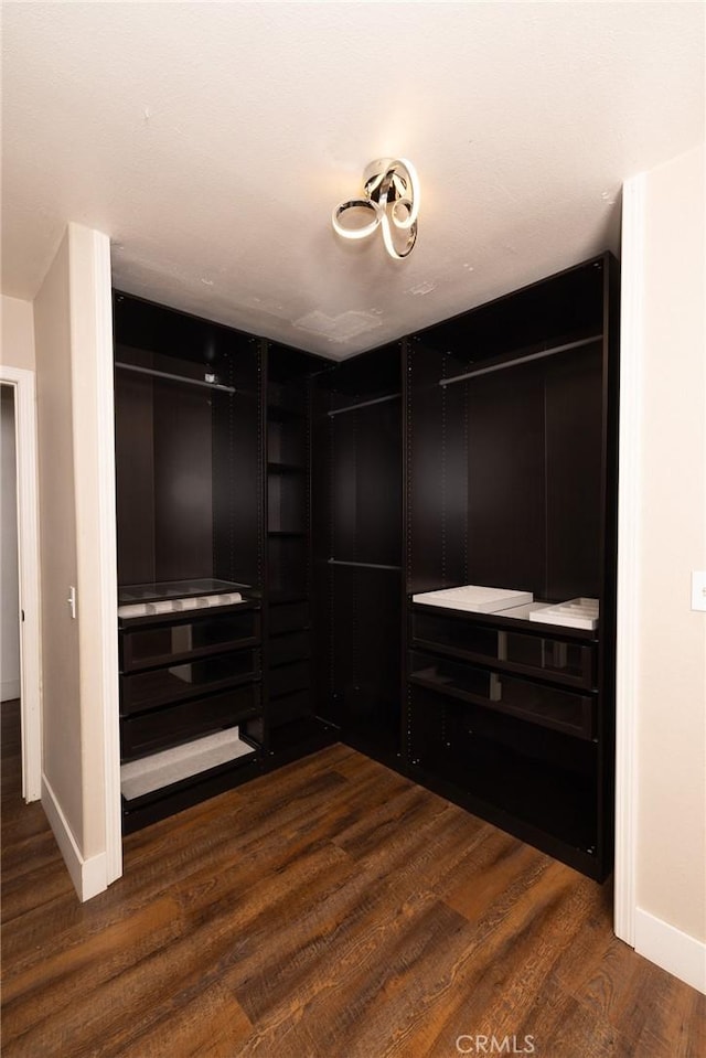 5760 Falling Leaf Ln, Jurupa Valley, CA 92509 - spacious closet featuring dark wood-style floors