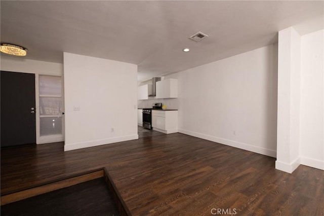 5760 Falling Leaf Ln, Jurupa Valley, CA 92509 - unfurnished living room featuring dark wood finished floors and recessed lighting