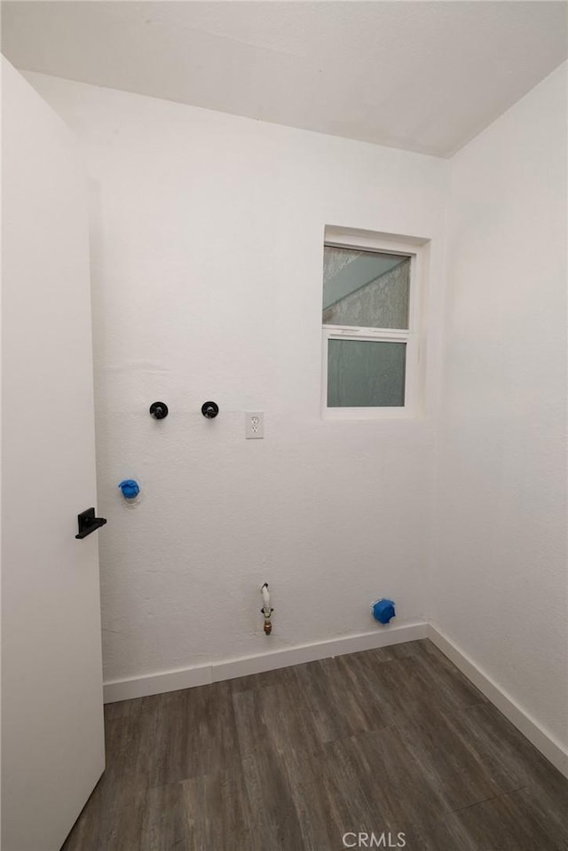 5760 Falling Leaf Ln, Jurupa Valley, CA 92509 - washroom featuring hookup for a gas dryer and dark wood-style flooring