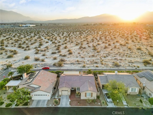 65565 Acoma Ave Unit 1, Desert Hot Springs, CA 92240 - aerial view at dusk of a mountain view and view of desert landscape