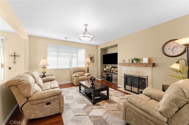 65565 Acoma Ave Unit 1, Desert Hot Springs, CA 92240 - living room with a fireplace and wood finished floors